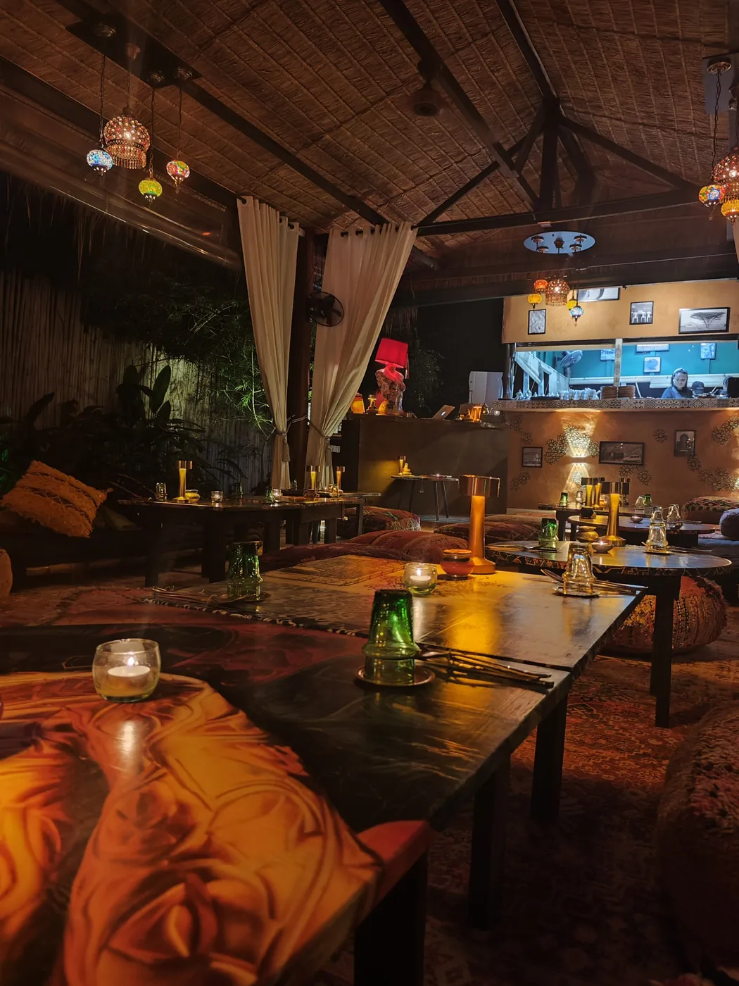 Warm candlelit tables in the main room at Dar Mansour