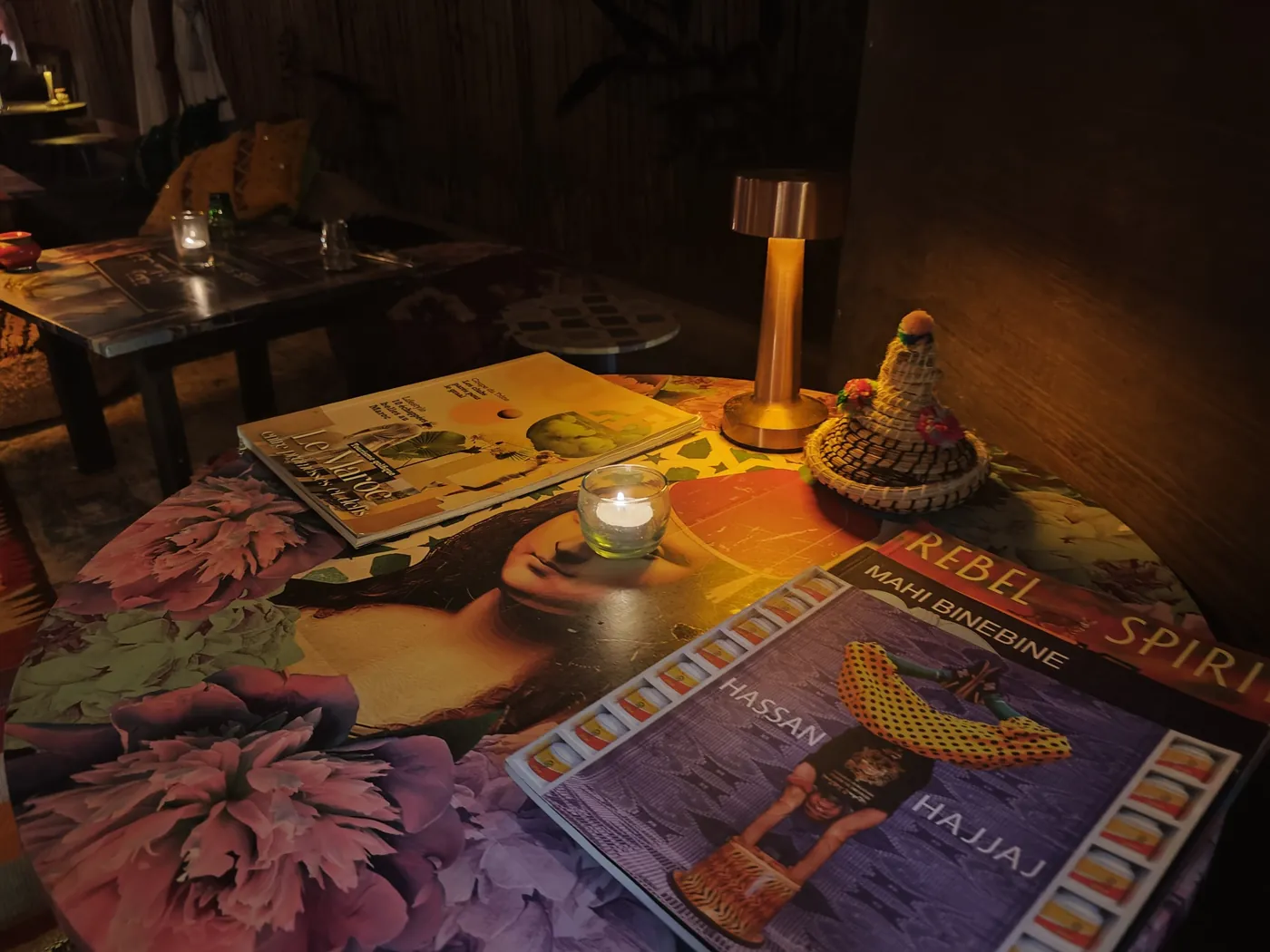 Moroccan art books and candlelight on an arty table at Dar Mansour