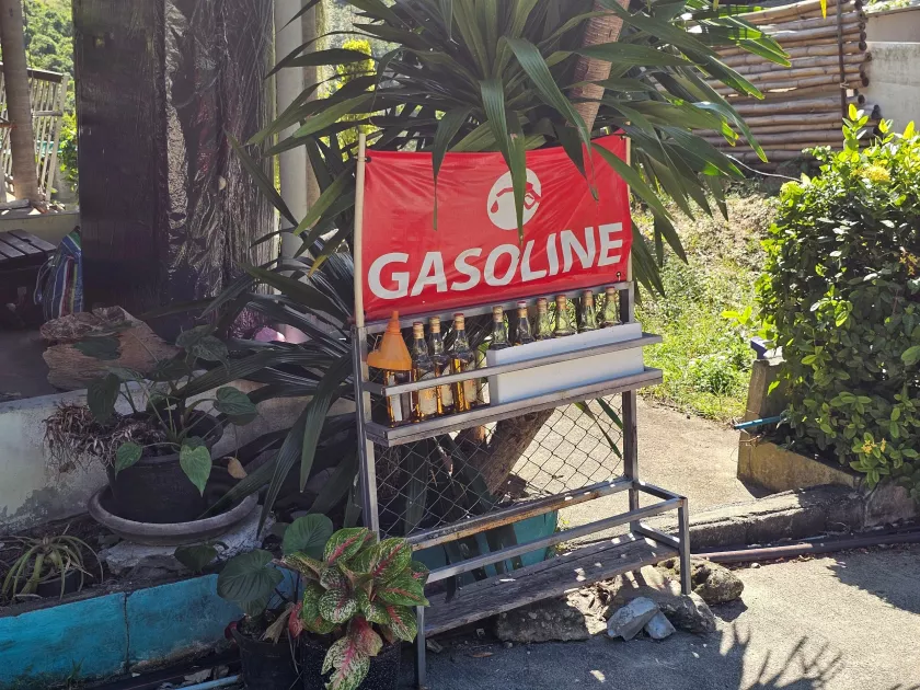 Roadside petrol sold in glass bottles, Koh Phangan Petrol sold in glass bottles at a roadside shop in Koh Phangan